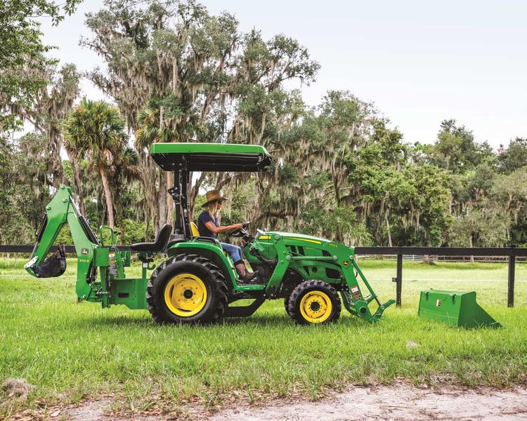 John Deere compact tractor with front loader and backhoe
